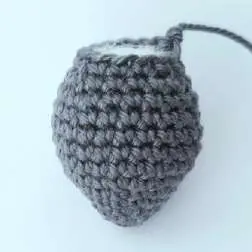 Gray crochet bat body, stuffed and shaped like a drop