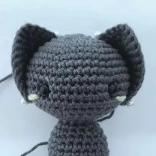 Gray crochet bat head with both ears sewn on