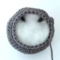 Inside of the crochet bat head filled with stuffing above the eyes