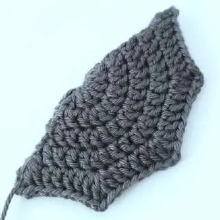Finished gray crochet bat wing with pointed scalloped edge