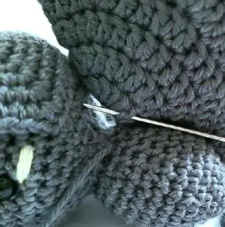 Close-up of the wing being attached to the bat body