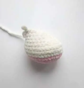 Crochet bunny leg with a pink sole and cream top
