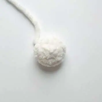 Small round cream crochet bunny tail